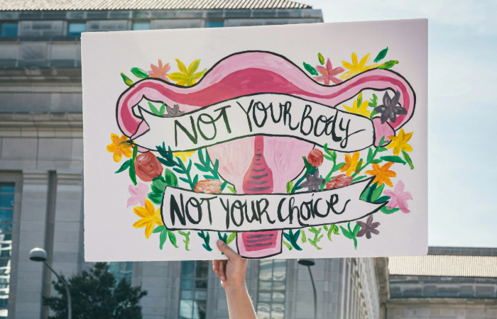 Alt Text: French parliamentarians vote in favor of amending the constitution to recognize abortion as a fundamental right, amidst widespread support and opposition. Vatican and anti-abortion groups criticize the move.