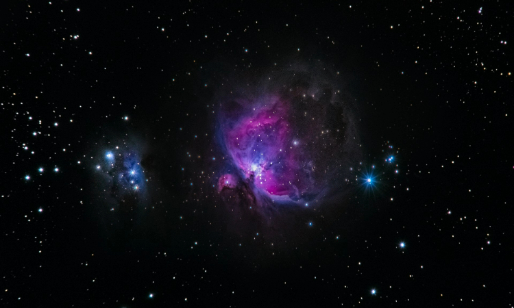 A visualization of a binary star system with a bright nova explosion, representing the imminent flare of T Coronae Borealis in the Corona Borealis constellation