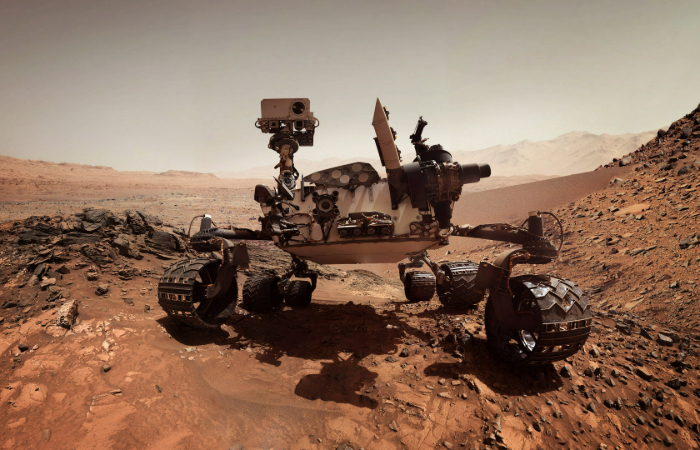 NASA's Perseverance Mars Rover investigating the Martian surface, analyzing rock formations for potential signs of ancient life